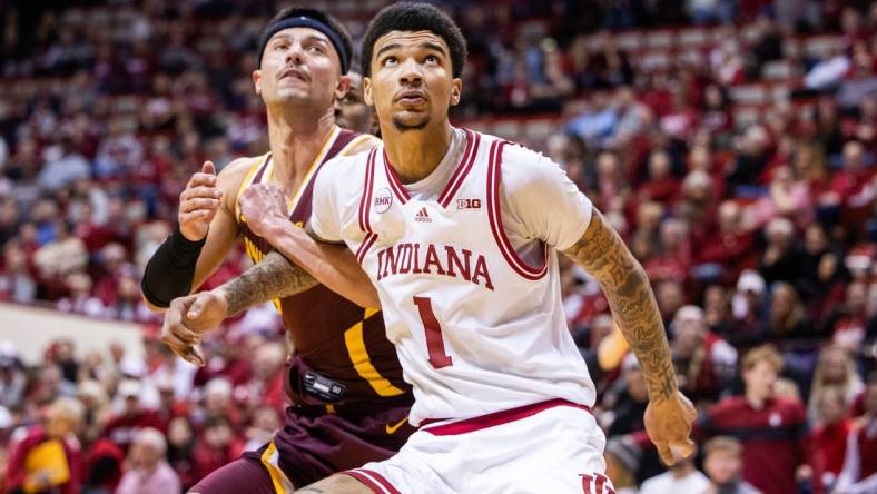 Jan 12, 2024; Bloomington, Indiana, USA; Indiana Hoosiers center Kel'el Ware (1) boxes out Minnesota Golden Gophers forward Dawson Garcia (3) in the second half at Simon Skjodt Assembly Hall. Mandatory Credit: Trevor Ruszkowski-USA TODAY Sports