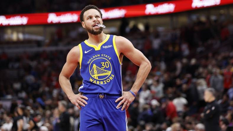 Jan 12, 2024; Chicago, Illinois, USA; Golden State Warriors guard Stephen Curry (30) reacts after a play during the second half against the Chicago Bulls at United Center. Mandatory Credit: Kamil Krzaczynski-USA TODAY Sports