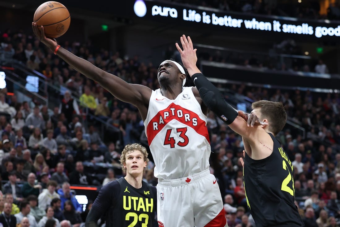 Jan 12, 2024; Salt Lake City, Utah, USA; Toronto Raptors forward Pascal Siakam (43) lays the ball up past Utah Jazz center Walker Kessler (24) during the third quarter at Delta Center. Mandatory Credit: Rob Gray-USA TODAY Sports