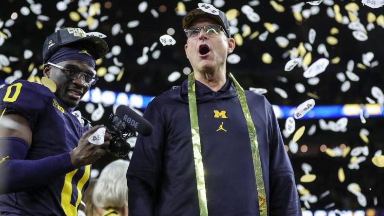 Michigan head coach Jim Harbaugh celebrates during the trophy presentation after the 34-13 win over Washington at the national championship game at NRG Stadium in Houston on Monday, Jan. 8, 2024.