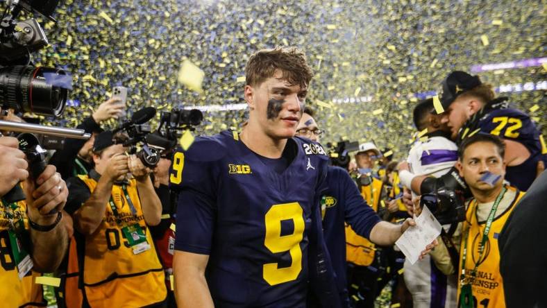 Michigan quarterback J.J. McCarthy celebrates after the 34-13 win over Washington to win the national championship game at NRG Stadium in Houston on Monday, Jan. 8, 2024.