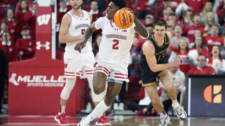 Jan 13, 2024; Madison, Wisconsin, USA; Wisconsin Badgers guard AJ Storr (2) dribbles the ball down the court following a turnover against Northwestern Wildcats during the second half at the Kohl Center. Mandatory Credit: Kayla Wolf-USA TODAY Sports