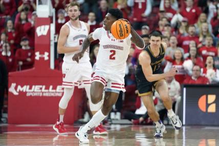 Jan 13, 2024; Madison, Wisconsin, USA; Wisconsin Badgers guard AJ Storr (2) dribbles the ball down the court following a turnover against Northwestern Wildcats during the second half at the Kohl Center. Mandatory Credit: Kayla Wolf-USA TODAY Sports