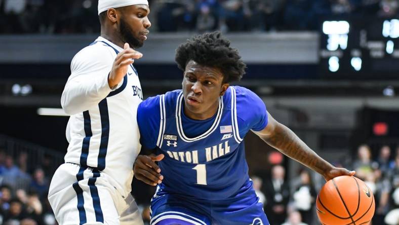 Jan 13, 2024; Indianapolis, Indiana, USA;  Seton Hall Pirates guard Kadary Richmond (1) dribbles the ball against Butler Bulldogs guard Posh Alexander (left) during the first half at Hinkle Fieldhouse. Mandatory Credit: Robert Goddin-USA TODAY Sports