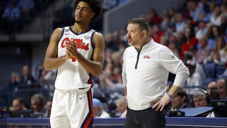 Jan 13, 2024; Oxford, Mississippi, USA; Mississippi Rebels head coach Chris Beard (right) talks with forward Jaemyn Brakefield (4) during the second half against the Vanderbilt Commodores at The Sandy and John Black Pavilion at Ole Miss. Mandatory Credit: Petre Thomas-USA TODAY Sports