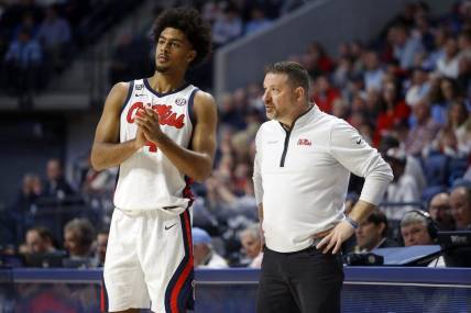 Jan 13, 2024; Oxford, Mississippi, USA; Mississippi Rebels head coach Chris Beard (right) talks with forward Jaemyn Brakefield (4) during the second half against the Vanderbilt Commodores at The Sandy and John Black Pavilion at Ole Miss. Mandatory Credit: Petre Thomas-USA TODAY Sports
