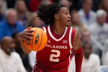 Oklahoma junior guard Javian McCollum (2) returns the ball after a Kansas basket in the first half of the game Saturday, Jan. 13, 2024, inside Allen Fieldhouse.
