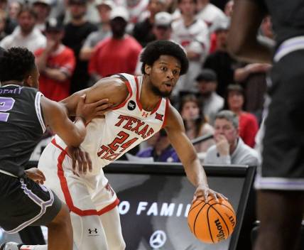 Texas Tech's guard Kerwin Walton (24) dribbles the ball against Kansas State in a Big 12 basketball game, Saturday, Jan.13, 2024, at United Supermarkets Arena.