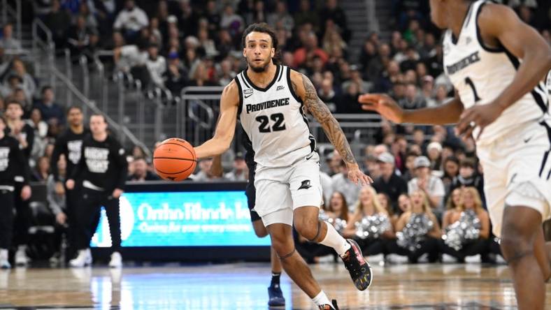 Jan 13, 2024; Providence, Rhode Island, USA; Providence Friars guard Devin Carter (22) passes the ball against the Xavier Musketeers during the first half at Amica Mutual Pavilion. Mandatory Credit:Eric Canha-USA TODAY Sports