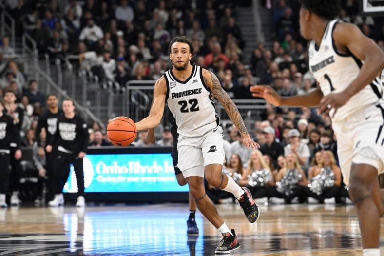 Jan 13, 2024; Providence, Rhode Island, USA; Providence Friars guard Devin Carter (22) passes the ball against the Xavier Musketeers during the first half at Amica Mutual Pavilion. Mandatory Credit:Eric Canha-USA TODAY Sports