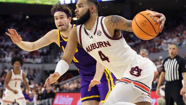Jan 13, 2024; Auburn, Alabama, USA; Auburn Tigers forward Johni Broome (4) drives to the goal during the second half against the LSU Tigers at Neville Arena. Mandatory Credit: John Reed-USA TODAY Sports