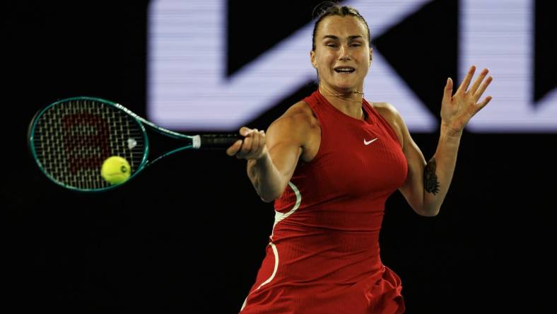 Jan 14, 2024; Melbourne, Victoria, Australia;  Aryna Sabalenka of Russia hits a shot at the Australian Open. Mandatory Credit: Mike Frey-USA TODAY Sports