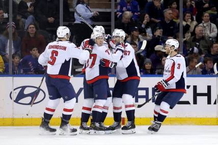 Jan 14, 2024; New York, New York, USA; Washington Capitals right wing T.J. Oshie (77) celebrates his goal against the New York Rangers with teammates during the second period at Madison Square Garden. Mandatory Credit: Brad Penner-USA TODAY Sports