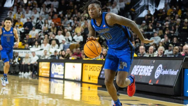 Jan 14, 2024; Wichita, Kansas, USA; Memphis Tigers guard Jaykwon Walton (10) brings the ball up court during the second half against the Wichita State Shockers at Charles Koch Arena. Mandatory Credit: William Purnell-USA TODAY Sports