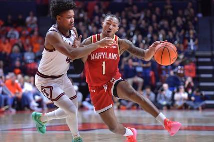 Jan 14, 2024; Champaign, Illinois, USA;  Maryland Terrapins guard Jahmir Young (1) drives the ball against Maryland Terrapins center Braden Pierce (4) during the second half at State Farm Center. Mandatory Credit: Ron Johnson-USA TODAY Sports