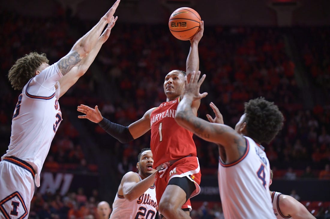 Jan 14, 2024; Champaign, Illinois, USA;  Maryland Terrapins guard Jahmir Young (1) shoots the ball over Illinois Fighting Illini forward Coleman Hawkins (33) on a drive to the basket  during the second half at State Farm Center. Mandatory Credit: Ron Johnson-USA TODAY Sports