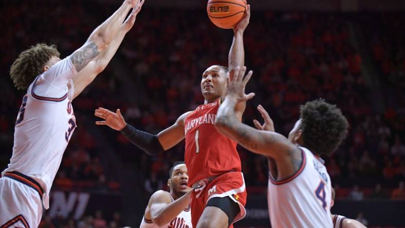 Jan 14, 2024; Champaign, Illinois, USA;  Maryland Terrapins guard Jahmir Young (1) shoots the ball over Illinois Fighting Illini forward Coleman Hawkins (33) on a drive to the basket  during the second half at State Farm Center. Mandatory Credit: Ron Johnson-USA TODAY Sports