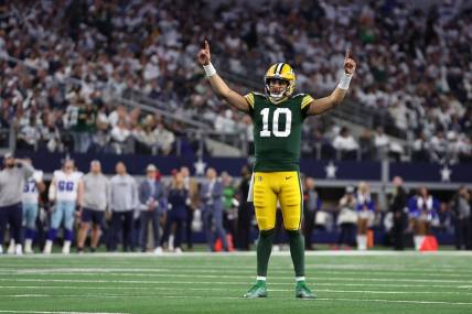 Jan 14, 2024; Arlington, Texas, USA; Green Bay Packers quarterback Jordan Love (10) reacts after a touchdown against the Dallas Cowboys during the second half of the  2024 NFC wild card game at AT&T Stadium. Mandatory Credit: Tim Heitman-USA TODAY Sports
