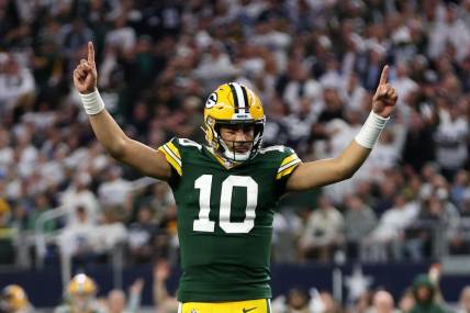 Jan 14, 2024; Arlington, Texas, USA; Green Bay Packers quarterback Jordan Love (10) reacts after a touchdown against the Dallas Cowboys in the first quarter for the 2024 NFC wild card game at AT&T Stadium. Mandatory Credit: Tim Heitman-USA TODAY Sports