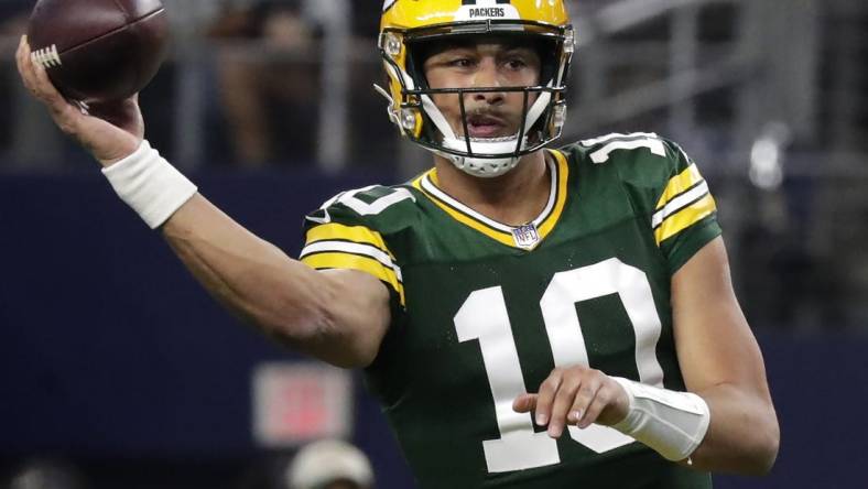 Jan 14, 2024; Arlington, Texas, USA; Green Bay Packers quarterback Jordan Love (10) throws against the Dallas cowboys during the second quarter in a 2024 NFC wild card game at AT&T Stadium. Mandatory Credit: Wm. Glasheen-USA TODAY Sports