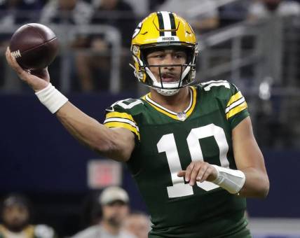 Jan 14, 2024; Arlington, Texas, USA; Green Bay Packers quarterback Jordan Love (10) throws against the Dallas cowboys during the second quarter in a 2024 NFC wild card game at AT&T Stadium. Mandatory Credit: Wm. Glasheen-USA TODAY Sports