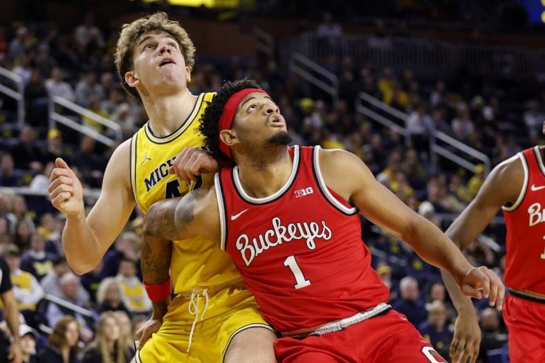 Jan 15, 2024; Ann Arbor, Michigan, USA; Michigan Wolverines forward Will Tschetter (42) and Ohio State Buckeyes guard Roddy Gayle Jr. (1) look for the rebound in the first half at Crisler Center. Mandatory Credit: Rick Osentoski-USA TODAY Sports