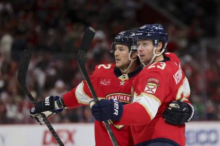 Jan 15, 2024; Sunrise, Florida, USA; Florida Panthers center Carter Verhaeghe (23) celebrates with center Sam Reinhart (13) after scoring against the Anaheim Ducks during the second period at Amerant Bank Arena. Mandatory Credit: Sam Navarro-USA TODAY Sports