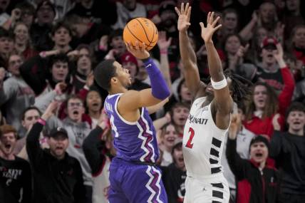 Jan 16, 2024; Cincinnati, Ohio, USA;  TCU Horned Frogs guard Jameer Nelson Jr. (4) drives to the basket against Cincinnati Bearcats guard Jizzle James (2) in the first half at Fifth Third Arena. Mandatory Credit: Aaron Doster-USA TODAY Sports