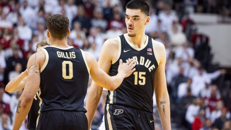 Jan 16, 2024; Bloomington, Indiana, USA; Purdue Boilermakers center Zach Edey (15) and forward Mason Gillis (0) celebrate a basket in the first half against the Indiana Hoosiers at Simon Skjodt Assembly Hall. Mandatory Credit: Trevor Ruszkowski-USA TODAY Sports