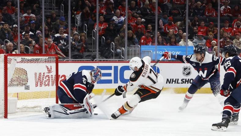 Jan 16, 2024; Washington, District of Columbia, USA; Anaheim Ducks left wing Alex Killorn (17) skates in on Washington Capitals goaltender Darcy Kuemper (35) as Capitals center Evgeny Kuznetsov (92) defends in the second period at Capital One Arena. Mandatory Credit: Geoff Burke-USA TODAY Sports