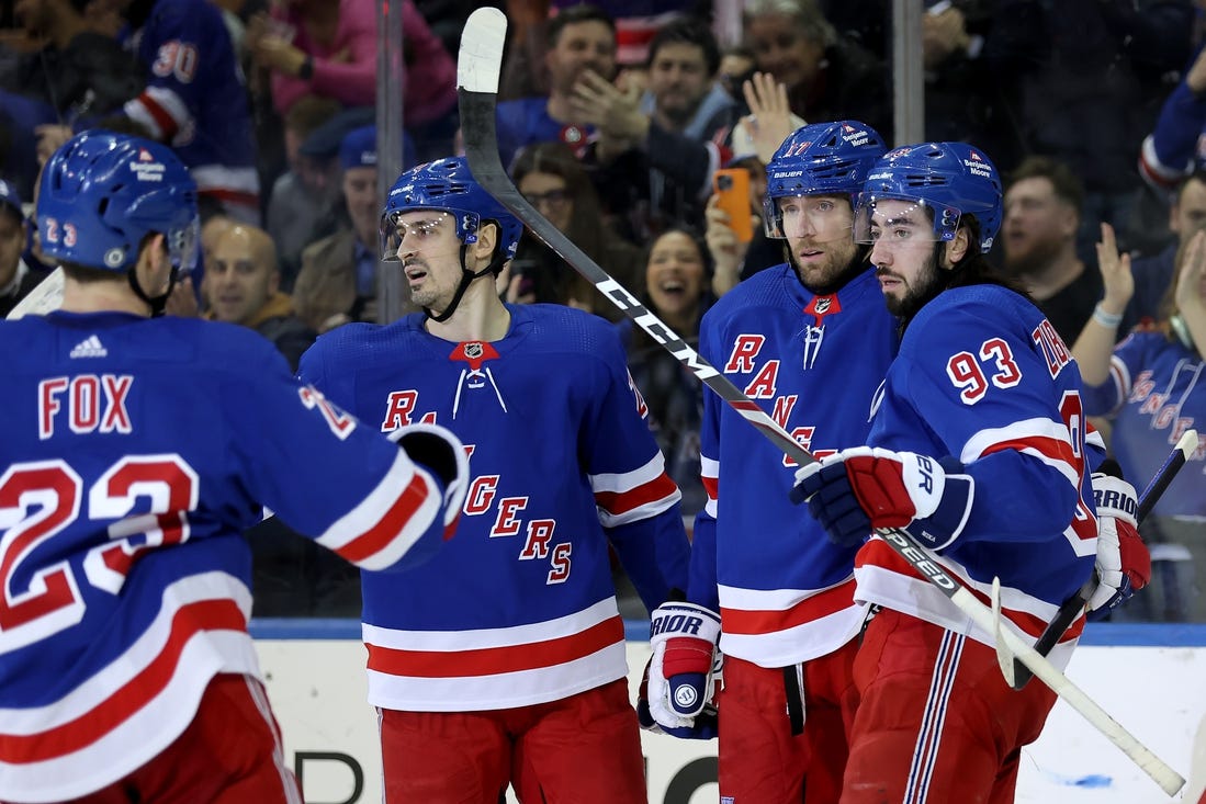 Jan 16, 2024; New York, New York, USA; New York Rangers right wing Blake Wheeler (17) celebrates his empty net goal against the Seattle Kraken with defenseman Adam Fox (23) and left wing Chris Kreider (20) and center Mika Zibanejad (93) during the third period at Madison Square Garden. Mandatory Credit: Brad Penner-USA TODAY Sports