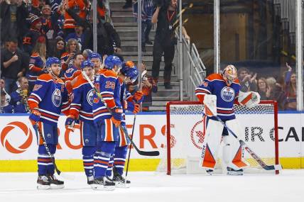 Jan 16, 2024; Edmonton, Alberta, CAN; The Edmonton Oilers celebrate a goal scored by defensemen Evan Bouchard (2) during the third period against the Toronto Maple Leafs at Rogers Place. Mandatory Credit: Perry Nelson-USA TODAY Sports