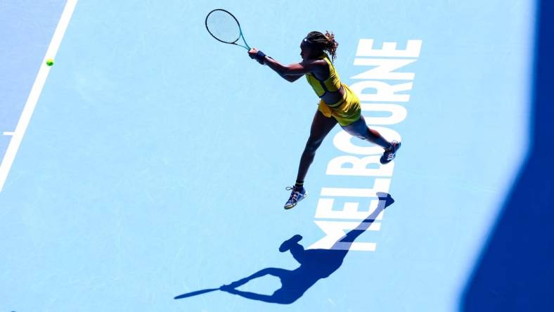 Jan 17, 2024; Melbourne, Victoria, Australia; Coco Gauff of the United States plays a shot against Caroline Dolehide (not pictured) also of the United States in Round 2 of the Women's Singles on Day 4 of the Australian Open tennis at Margaret Court Arena. Mandatory Credit: Mike Frey-USA TODAY Sports