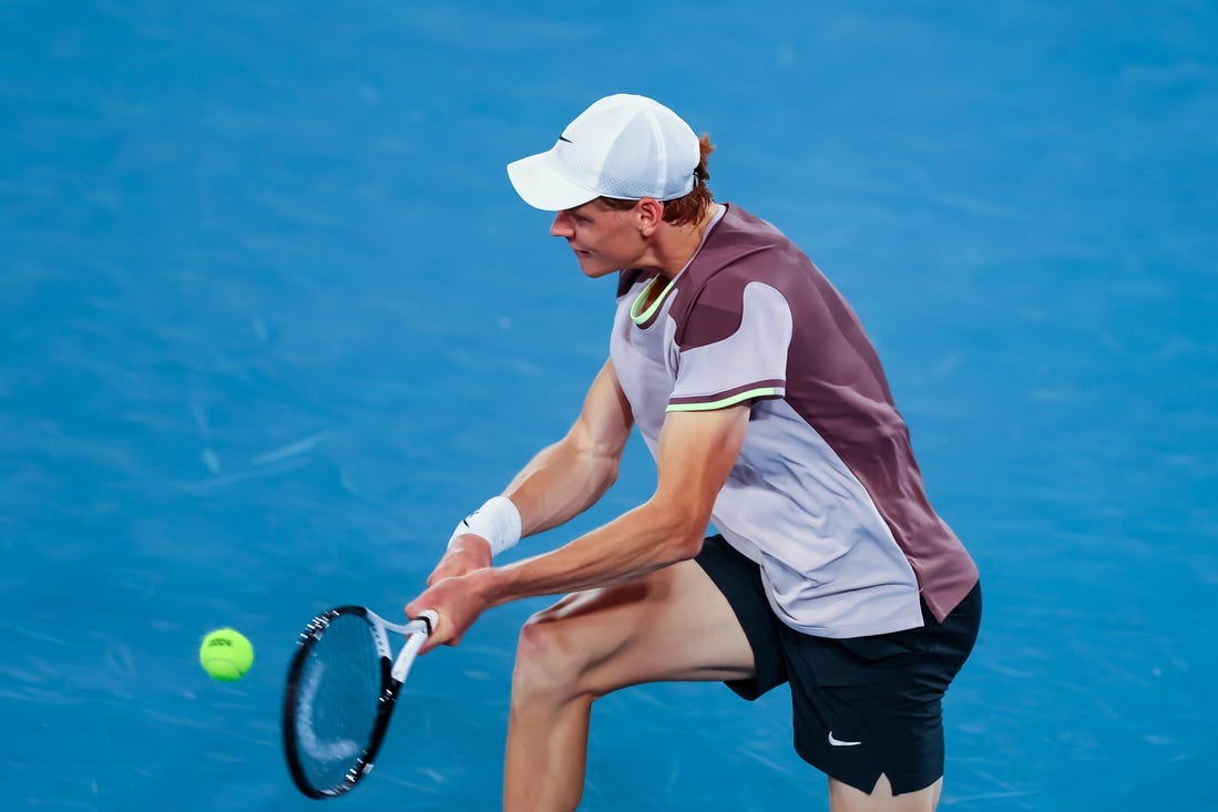 Jan 17, 2024; Melbourne, Victoria, Australia; Jannik Sinner of Italy plays a shot against Jesper de Jong (not pictured) of Netherlands in Round 2 of the Men's Singles on Day 4 of the Australian Open tennis at Rod Laver Arena.Mandatory Credit: Mike Frey-USA TODAY Sports