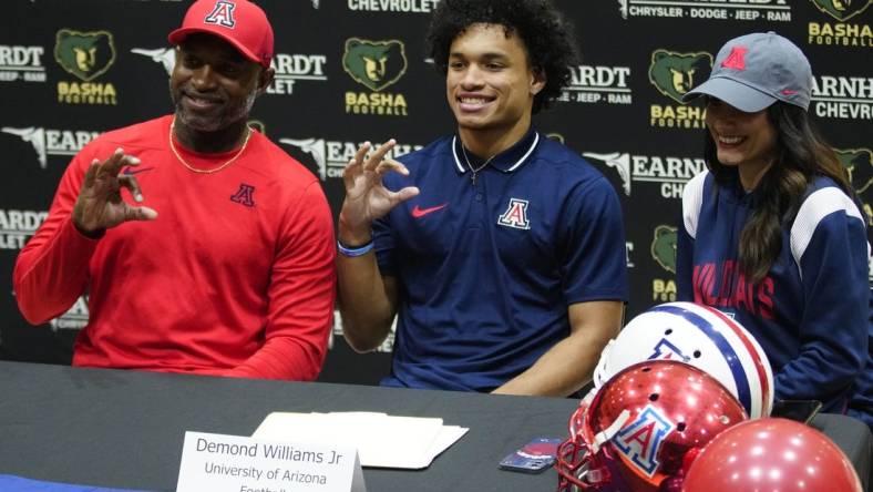 Basha quarterback Demond Williams poses for pictures after signing his letter of intent to play for University of Arizona during the NLI signing at Basha High School in Chandler on Dec. 20, 2023.