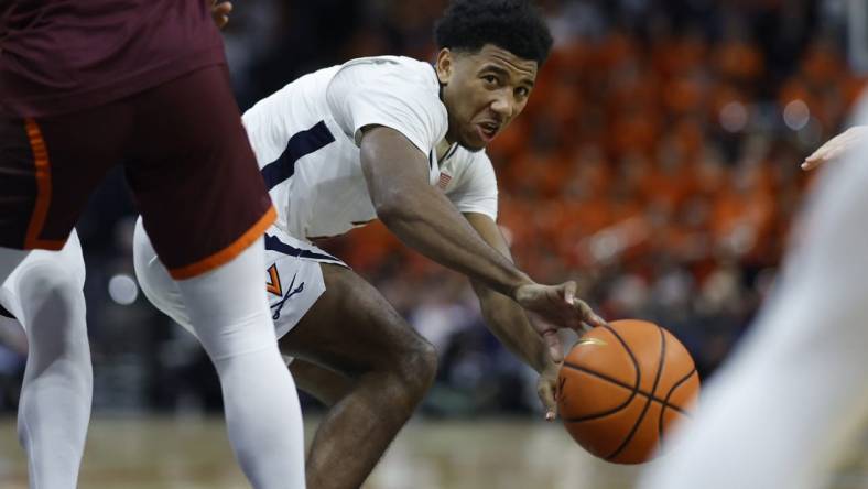 Jan 17, 2024; Charlottesville, Virginia, USA; Virginia Cavaliers guard Reece Beekman (2) passes the ball against the Virginia Tech Hokies in the second half at John Paul Jones Arena. Mandatory Credit: Geoff Burke-USA TODAY Sports