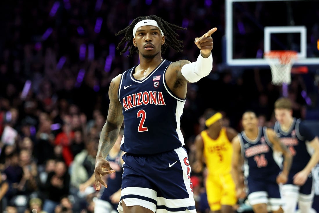 Jan 17, 2024; Tucson, Arizona, USA; Arizona Wildcats guard Caleb Love (2) celebrates a 3-point basket with the Arizona Wildcats bench against the USC Trojansduring the first half at McKale Center. Mandatory Credit: Zachary BonDurant-USA TODAY Sports