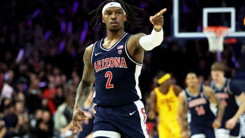 Jan 17, 2024; Tucson, Arizona, USA; Arizona Wildcats guard Caleb Love (2) celebrates a 3-point basket with the Arizona Wildcats bench against the USC Trojansduring the first half at McKale Center. Mandatory Credit: Zachary BonDurant-USA TODAY Sports