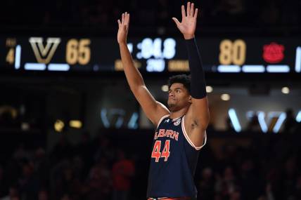 Jan 17, 2024; Nashville, Tennessee, USA; Auburn Tigers center Dylan Cardwell (44) celebrates in the closing seconds of the second half of a win against the Vanderbilt Commodores at Memorial Gymnasium. Mandatory Credit: Christopher Hanewinckel-USA TODAY Sports