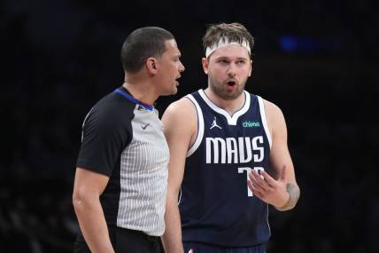 Jan 17, 2024; Los Angeles, California, USA; Dallas Mavericks guard Luka Doncic (77) reacts to a call by referee Nate Green in the second half against the Los Angeles Lakers at Crypto.com Arena. Mandatory Credit: Kirby Lee-USA TODAY Sports