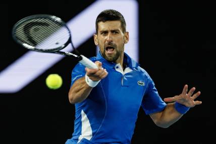Jan 17, 2024; Melbourne, Victoria, Australia; Novak Djokovic Serbia plays a shot against Alexei Popyrin (not pictured) of Australia in Round 2 of the Men's Singles on Day 4 of the Australian Open tennis at Rod Laver Arena. Mandatory Credit: Mike Frey-USA TODAY Sports