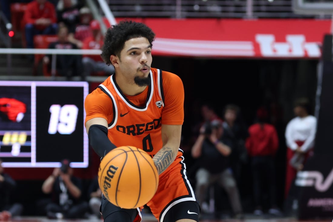 Jan 18, 2024; Salt Lake City, Utah, USA; Oregon State Beavers guard Jordan Pope (0) passes the ball against the Utah Utes during the first half at Jon M. Huntsman Center. Mandatory Credit: Rob Gray-USA TODAY Sports