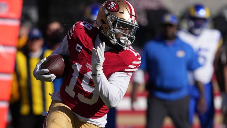 Jan 7, 2024; Santa Clara, California, USA; San Francisco 49ers wide receiver Deebo Samuel (19) runs after a catch against the Los Angeles Rams during the first quarter at Levi's Stadium. Mandatory Credit: Darren Yamashita-USA TODAY Sports