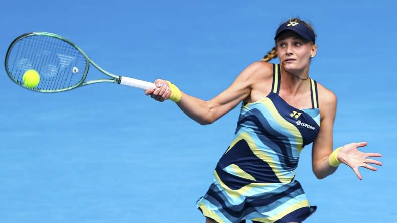 Jan 20, 2024; Melbourne, Victoria, Australia; Dayana Yastremska of Ukraine plays a shot against Emma Navarro (not pictured) of the United States in Round 3 of the Women's Singles on Day 6 of the Australian Open tennis at John Cain Arena. Mandatory Credit: Mike Frey-USA TODAY Sports