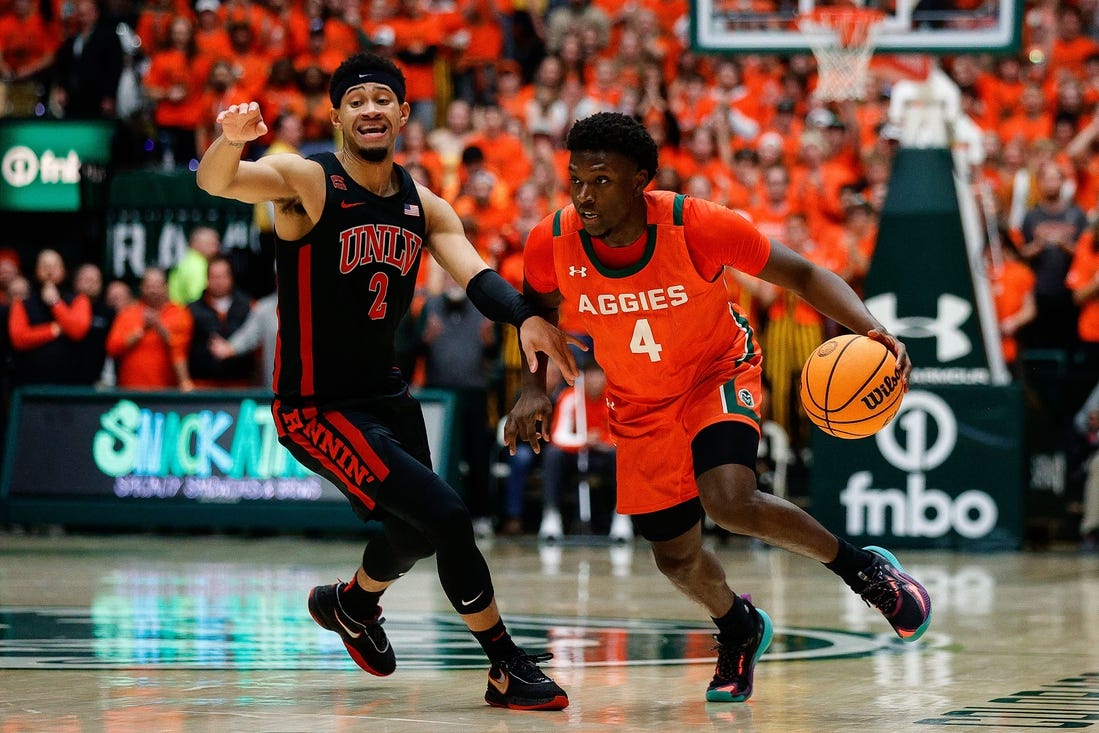 Jan 19, 2024; Fort Collins, Colorado, USA; Colorado State Rams guard Isaiah Stevens (4) controls the ball as UNLV Rebels guard Justin Webster (2) guards in the second half at Moby Arena. Mandatory Credit: Isaiah J. Downing-USA TODAY Sports