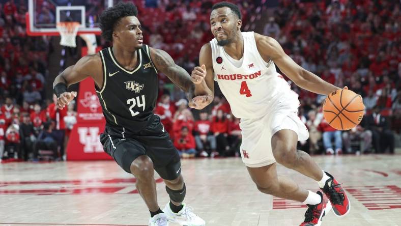 Jan 20, 2024; Houston, Texas, USA; Houston Cougars guard L.J. Cryer (4) drives with the ball as UCF Knights guard Jaylin Sellers (24) defends during the first half at Fertitta Center. Mandatory Credit: Troy Taormina-USA TODAY Sports