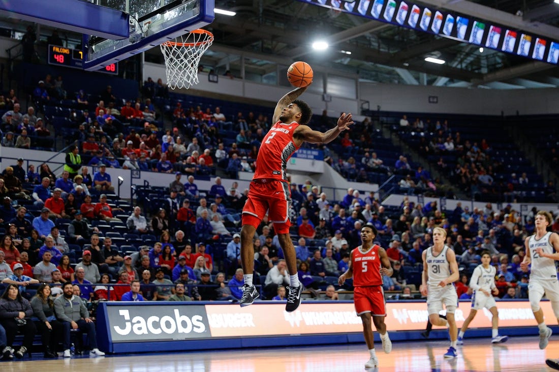 Jan 20, 2024; Colorado Springs, Colorado, USA; New Mexico Lobos guard Donovan Dent (2) dunks the ball in the second half against the Air Force Falcons at Clune Arena. Mandatory Credit: Isaiah J. Downing-USA TODAY Sports