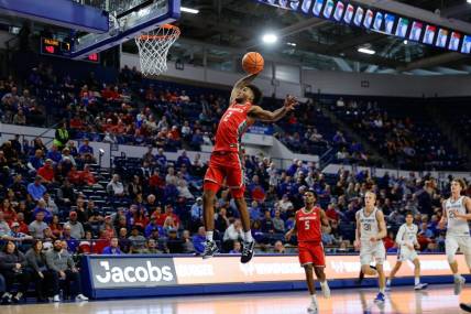 Jan 20, 2024; Colorado Springs, Colorado, USA; New Mexico Lobos guard Donovan Dent (2) dunks the ball in the second half against the Air Force Falcons at Clune Arena. Mandatory Credit: Isaiah J. Downing-USA TODAY Sports