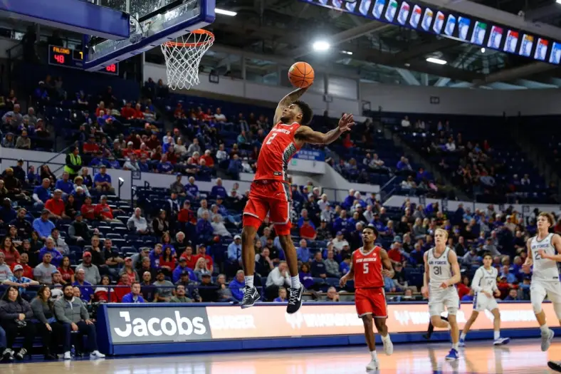 Jan 20, 2024; Colorado Springs, Colorado, USA; New Mexico Lobos guard Donovan Dent (2) dunks the ball in the second half against the Air Force Falcons at Clune Arena. Mandatory Credit: Isaiah J. Downing-USA TODAY Sports