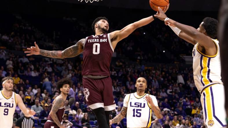 Jan 20, 2024; Baton Rouge, Louisiana, USA;  LSU Tigers guard Jordan Wright (6) knocks the rebound away from Texas A&M Aggies guard Jace Carter (0) during the second half at Pete Maravich Assembly Center. Mandatory Credit: Stephen Lew-USA TODAY Sports